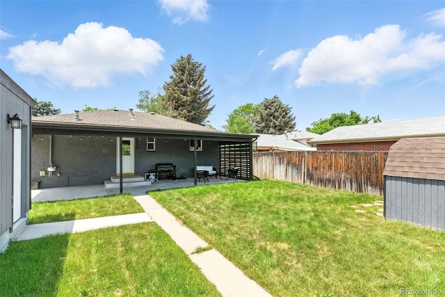 2050 S Wolff St, Denver, CO 80219 - view of yard featuring a patio area, a storage shed, and entry steps