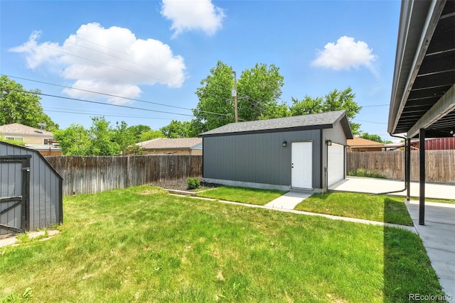 2050 S Wolff St, Denver, CO 80219 - fenced backyard featuring an outbuilding and a patio