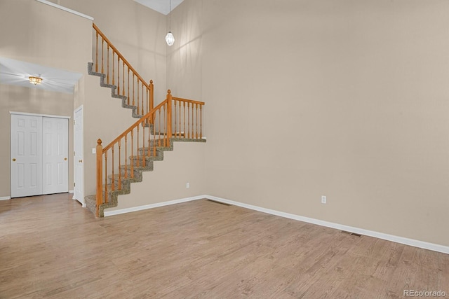 9874 Grove St Unit B, Westminster, CO 80031 - stairs featuring wood finished floors and a high ceiling