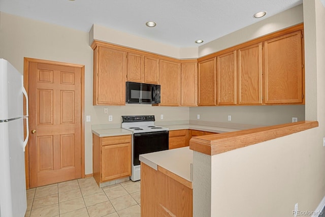 9874 Grove St Unit B, Westminster, CO 80031 - kitchen featuring white appliances, light tile patterned flooring, light countertops, a peninsula, and recessed lighting