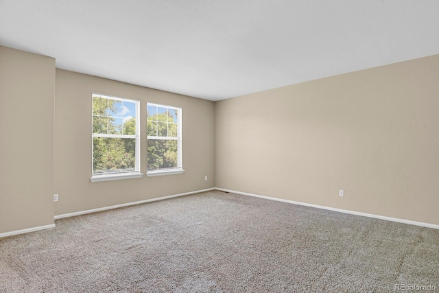 9874 Grove St Unit B, Westminster, CO 80031 - spare room featuring carpet flooring and baseboards