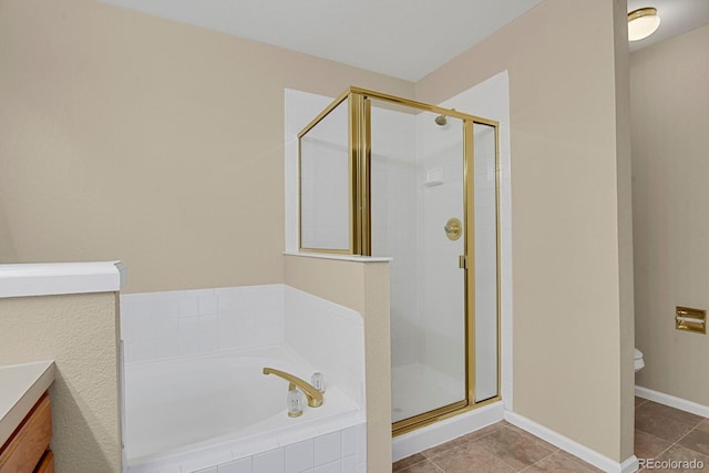 9874 Grove St Unit B, Westminster, CO 80031 - full bathroom featuring a garden tub, a stall shower, vanity, and tile patterned flooring