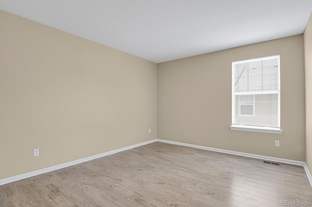 9874 Grove St Unit B, Westminster, CO 80031 - unfurnished room with light wood-style floors and baseboards