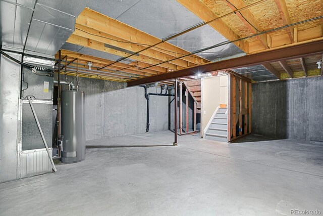 9874 Grove St Unit B, Westminster, CO 80031 - unfinished basement with gas water heater, stairway, and heating unit