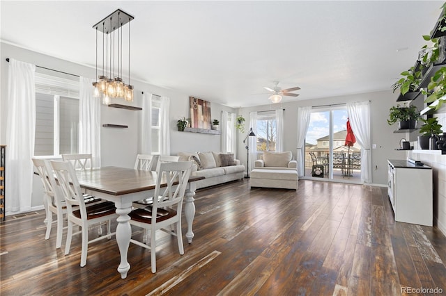 dining room with dark hardwood / wood-style floors and ceiling fan