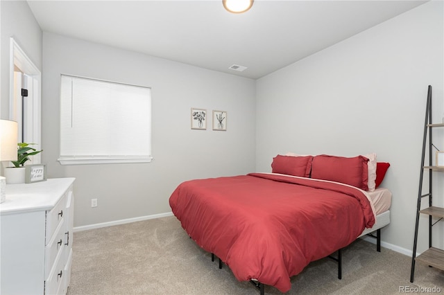 bedroom with light carpet