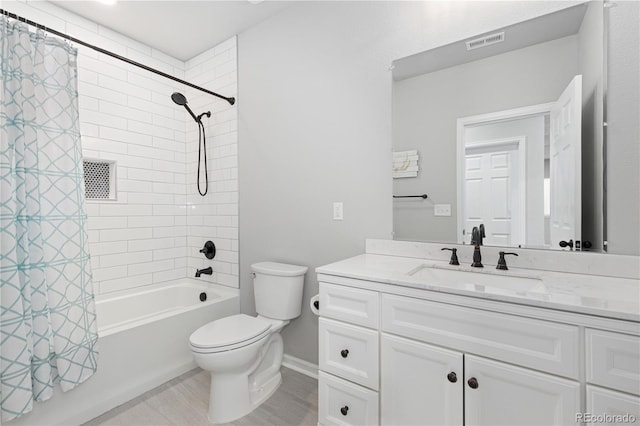 full bathroom with shower / tub combo, vanity, hardwood / wood-style flooring, and toilet