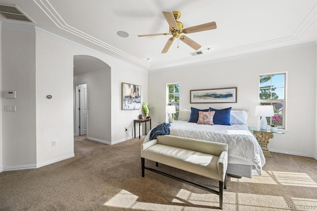 bedroom with arched walkways, carpet flooring, ornamental molding, baseboards, and ceiling fan
