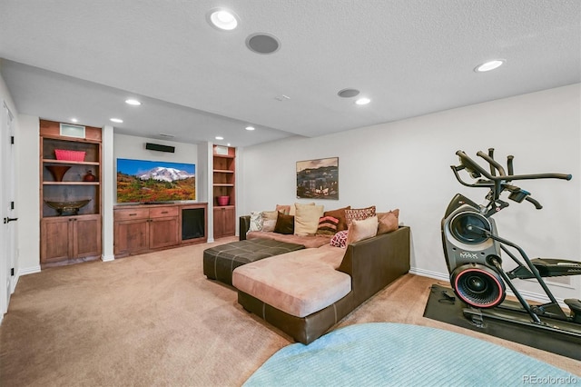 living area with recessed lighting, light colored carpet, a textured ceiling, built in features, and baseboards