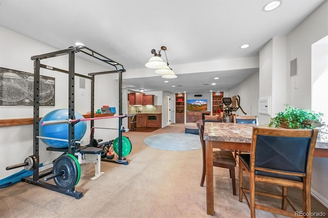dining room with recessed lighting and light colored carpet