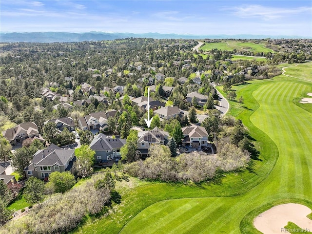 aerial perspective of suburban area featuring a local golf course