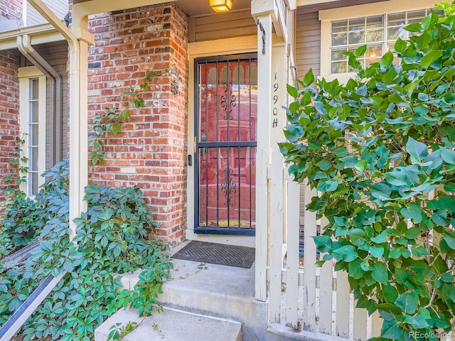 1990 S Helena St Unit H, Aurora, CO 80013 - doorway to property featuring brick siding