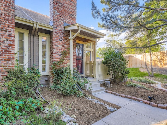 1990 S Helena St Unit H, Aurora, CO 80013 - property entrance with a chimney and brick siding