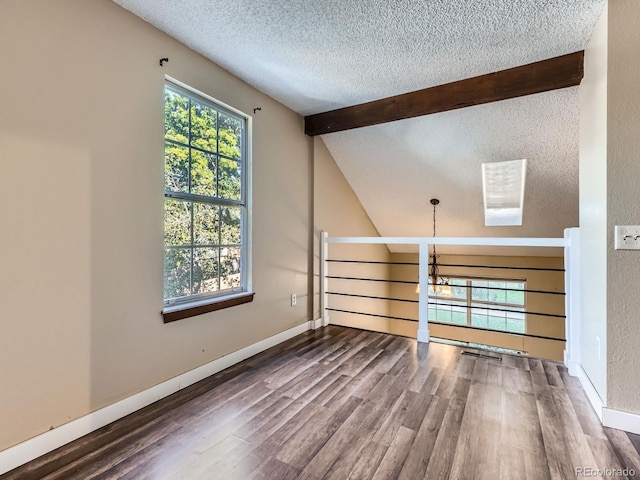 1990 S Helena St Unit H, Aurora, CO 80013 - empty room with a textured ceiling, wood finished floors, and a chandelier