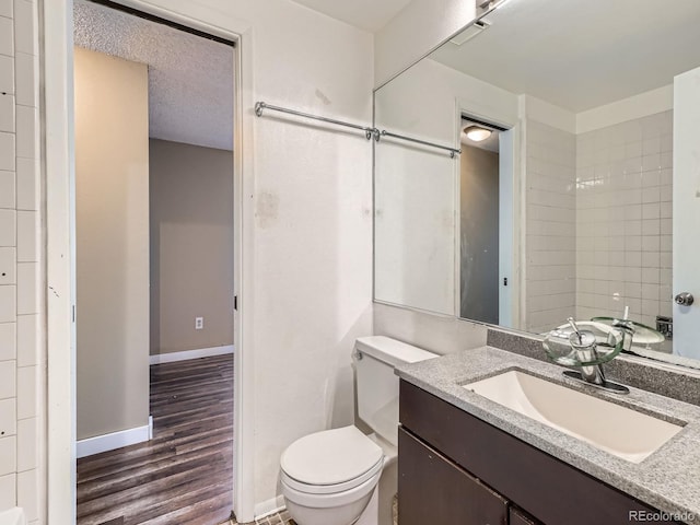 1990 S Helena St Unit H, Aurora, CO 80013 - bathroom featuring vanity and wood finished floors