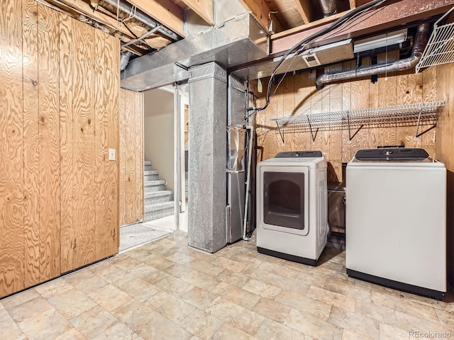 1990 S Helena St Unit H, Aurora, CO 80013 - laundry area with independent washer and dryer and stone finish flooring