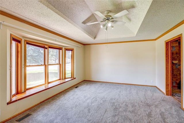 200 E 6th St, Flagler, CO 80815 - carpeted spare room featuring crown molding, a textured ceiling, and ceiling fan