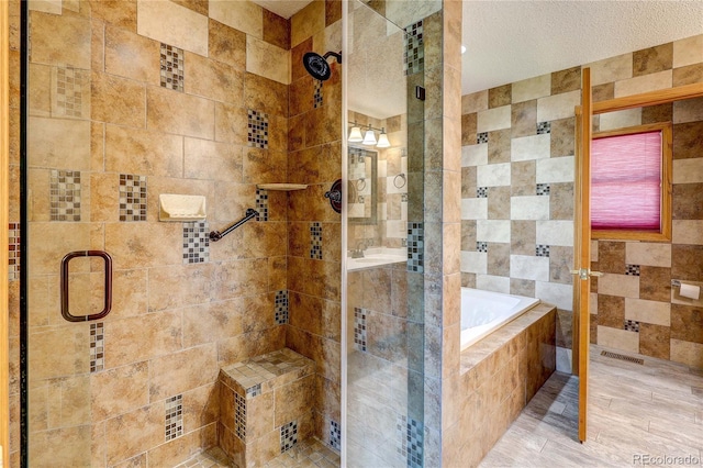200 E 6th St, Flagler, CO 80815 - bathroom with a shower stall and a bath