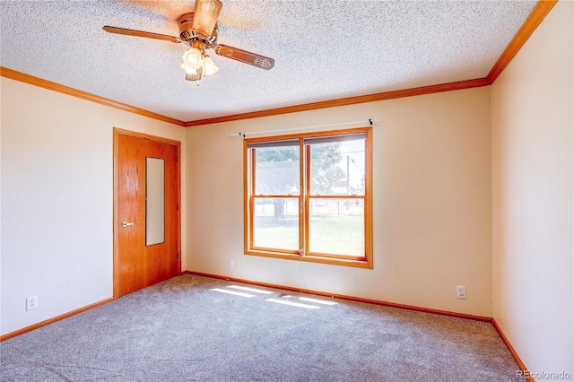 200 E 6th St, Flagler, CO 80815 - empty room featuring carpet flooring, a ceiling fan, a textured ceiling, and ornamental molding