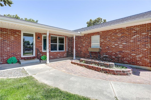 200 E 6th St, Flagler, CO 80815 - doorway to property with brick siding