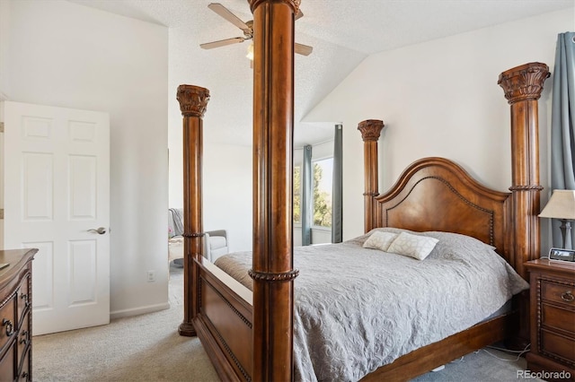 bedroom featuring a textured ceiling, light colored carpet, vaulted ceiling, and ceiling fan