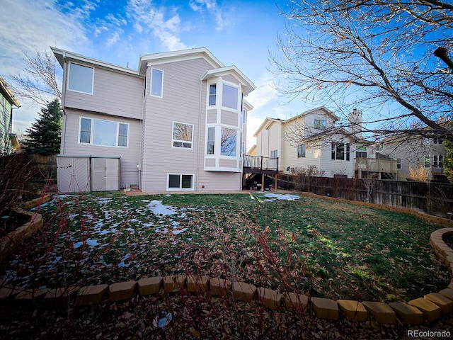 rear view of house with a lawn