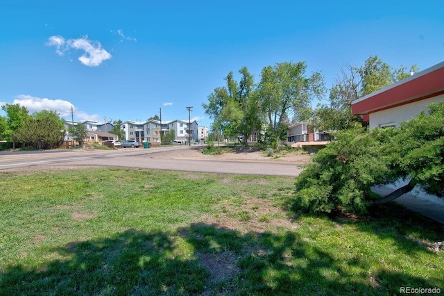 1560 Simms St, Lakewood, CO 80215 - view of grassy yard featuring a residential view