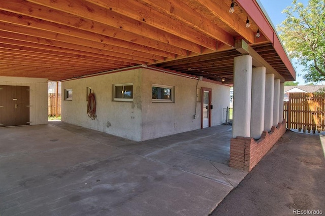 1560 Simms St, Lakewood, CO 80215 - view of patio featuring a carport