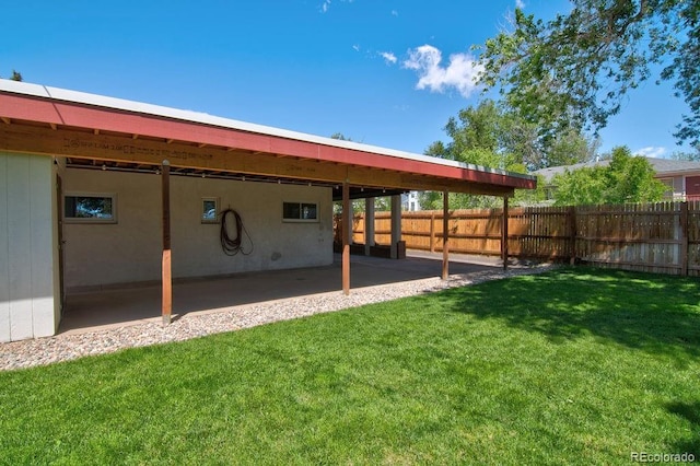 1560 Simms St, Lakewood, CO 80215 - view of yard with an attached carport and a patio area
