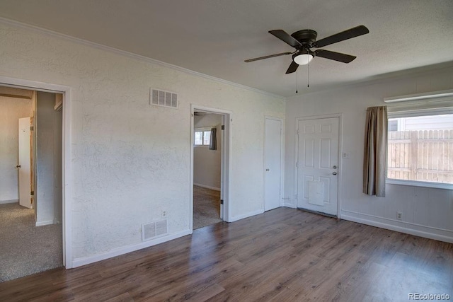 1560 Simms St, Lakewood, CO 80215 - spare room featuring ornamental molding, ceiling fan, wood finished floors, and baseboards
