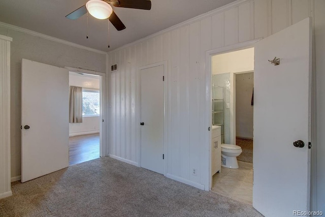 1560 Simms St, Lakewood, CO 80215 - unfurnished bedroom with crown molding, carpet, ensuite bath, and ceiling fan
