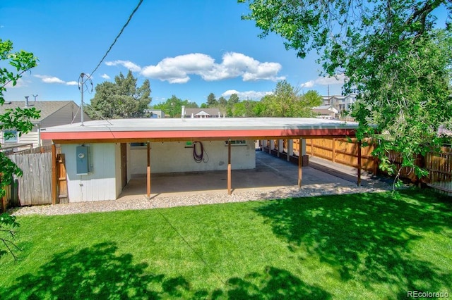 1560 Simms St, Lakewood, CO 80215 - rear view of property featuring a carport