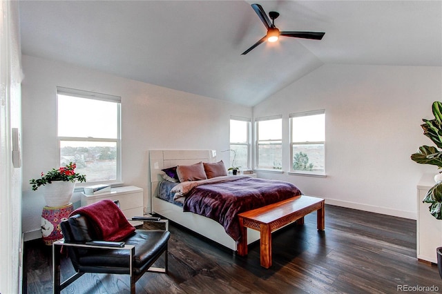 bedroom featuring lofted ceiling, multiple windows, ceiling fan, and dark hardwood / wood-style floors