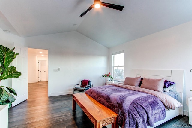 bedroom featuring ceiling fan, dark hardwood / wood-style flooring, and vaulted ceiling