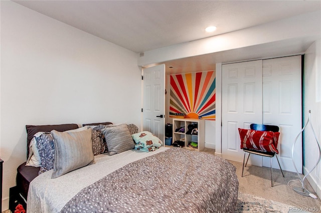 bedroom with a closet and carpet floors