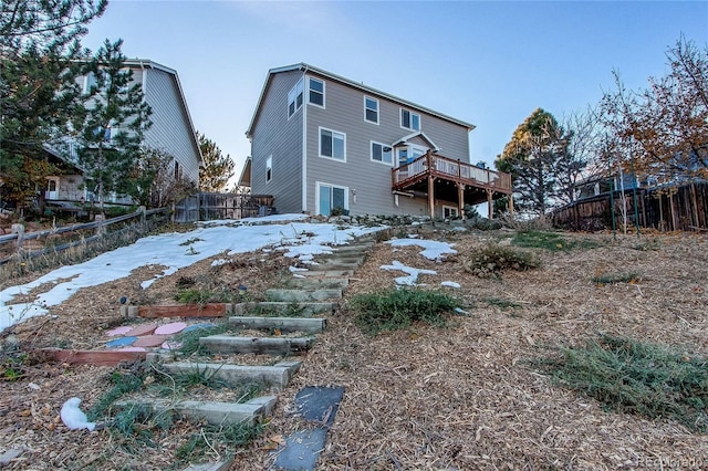 rear view of house with a wooden deck