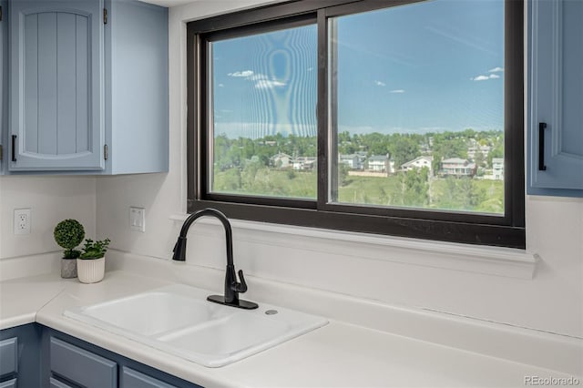 551 Snowy Owl Pl, Highlands Ranch, CO 80126 - kitchen featuring light countertops and blue cabinets