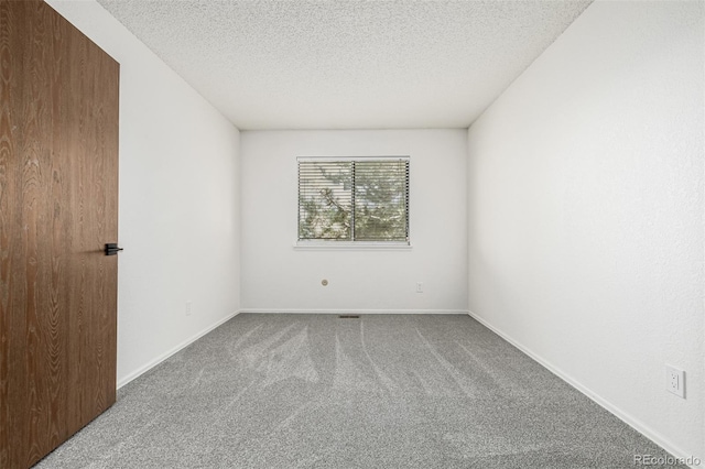 551 Snowy Owl Pl, Highlands Ranch, CO 80126 - carpeted empty room featuring a textured ceiling and baseboards