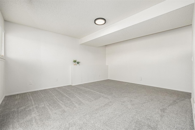 551 Snowy Owl Pl, Highlands Ranch, CO 80126 - carpeted spare room with baseboards and a textured ceiling