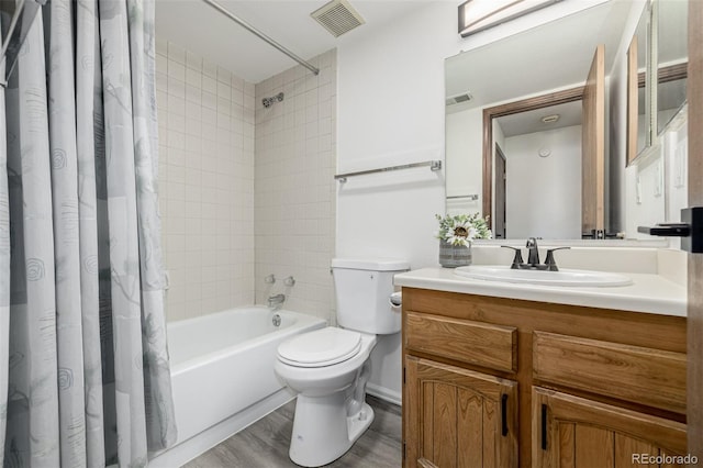 551 Snowy Owl Pl, Highlands Ranch, CO 80126 - bathroom with vanity, shower / tub combo, and wood finished floors