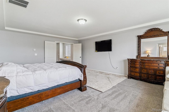 bedroom with light carpet, visible vents, and baseboards