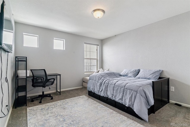 carpeted bedroom with baseboards