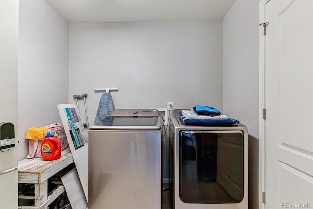 laundry area featuring laundry area and independent washer and dryer