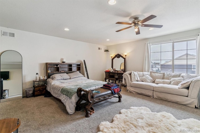 bedroom with ceiling fan, recessed lighting, visible vents, and light colored carpet