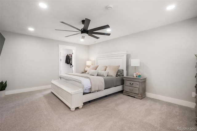 bedroom with light colored carpet, recessed lighting, baseboards, and ceiling fan