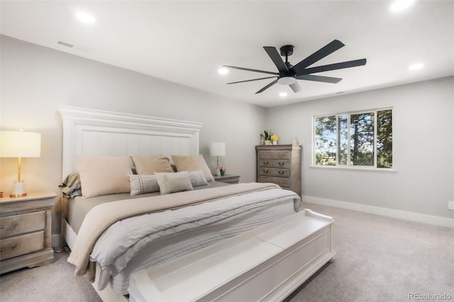 bedroom featuring light carpet, recessed lighting, baseboards, and a ceiling fan