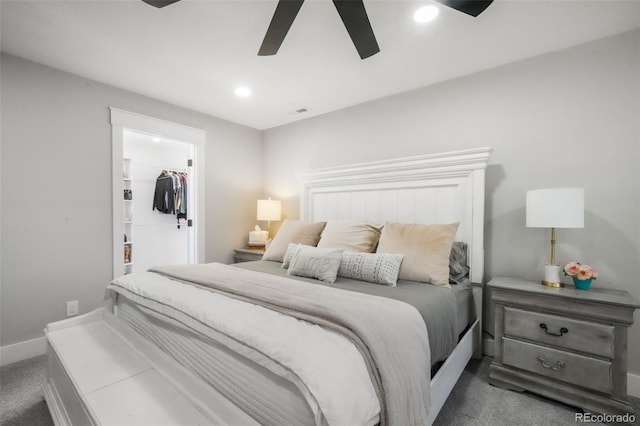 carpeted bedroom with baseboards, a spacious closet, recessed lighting, a ceiling fan, and a closet