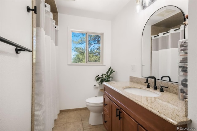 bathroom with vanity, tile patterned flooring, toilet, curtained shower, and baseboards