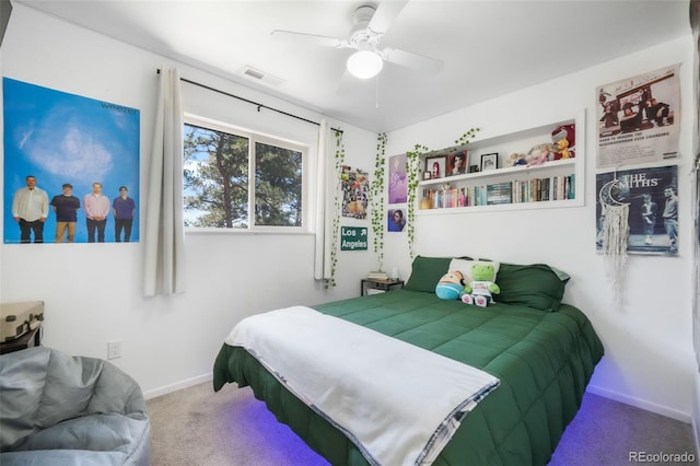 carpeted bedroom with baseboards and ceiling fan
