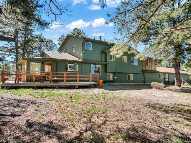 back of property with a deck